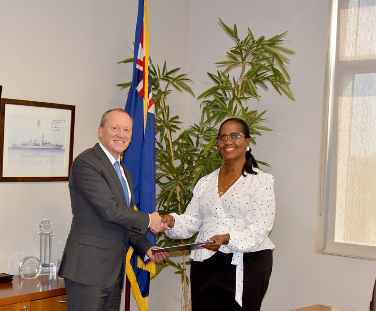 His Excellency Governor Martyn Roper hands the proclamation declaring 7 January ‘UWI Day’ to Dr. Beverly Shirley, Head of the UWI Open Campus in the Cayman Islands.
