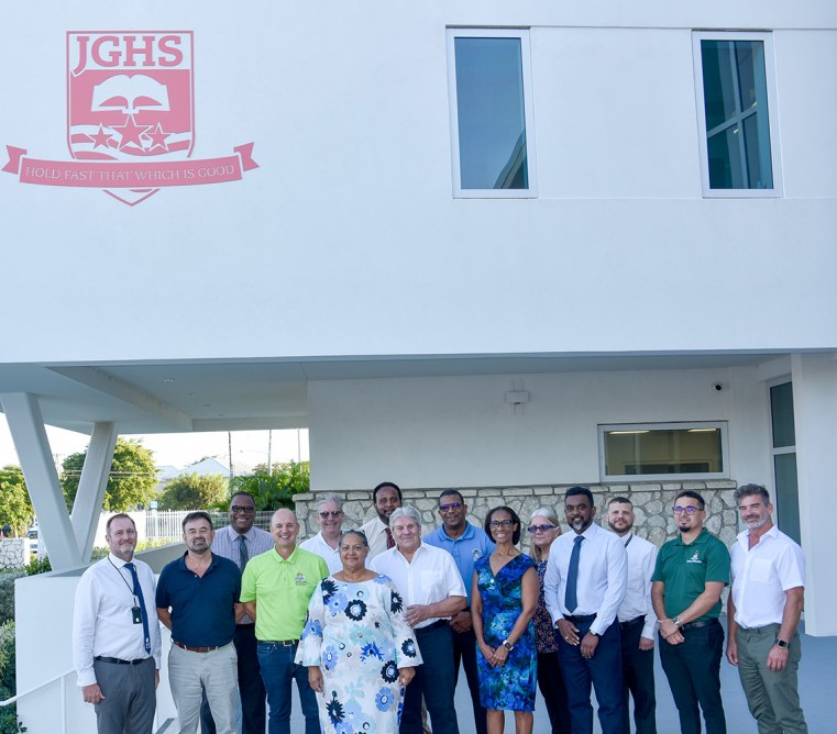 Education Minister Hon. Juliana O’Connor-Connolly (4th from left) joins in a photo with several key stakeholders during the new John Gray High School (JGHS) handover. Also included in the picture are