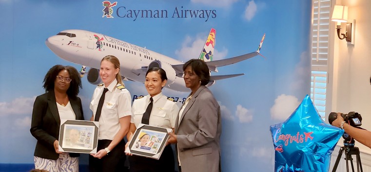 (L- R) Pilots Jessica Ebanks and Leanni Tibbets receive special recognition at a recent Cayman Airways event in honour of the Airlines’ pilots’ recent promotions.