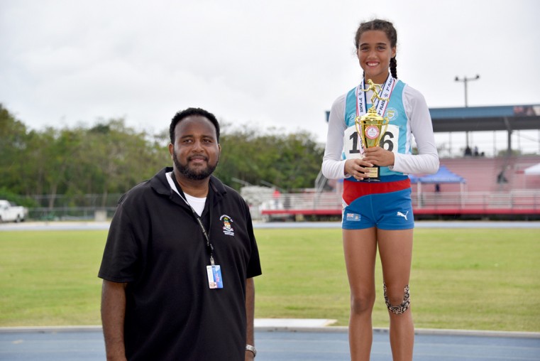 Victrix Ludorum, Sereniti Rankin (r) is photographed with DES Deputy Director, Mr. Elroy Bryan (l).