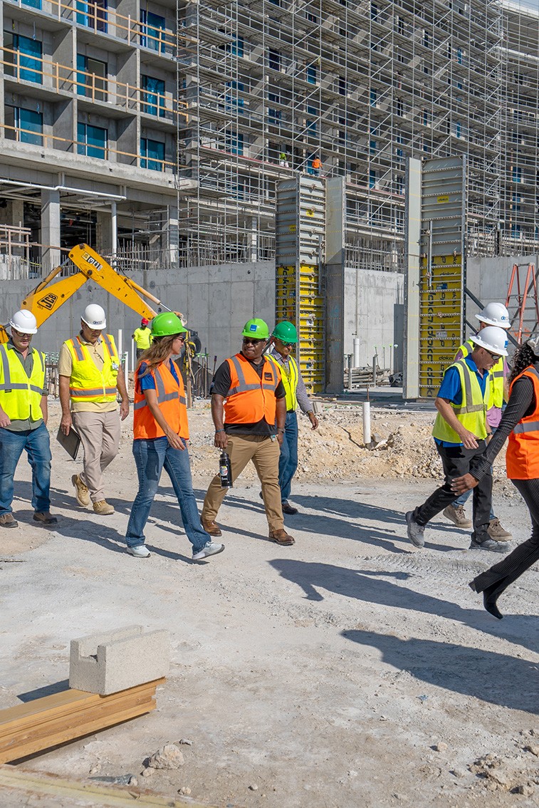 Members of the Dart construction team and Chief Officer Wesley Howell, Ministry for Border Control and Labour, during a walkthrough of the Hotel Indigo construction site.