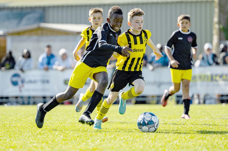 Jayden Wambugu – Total Soccer Cayman’s Harry Heinicke races toward the ball during his team’s 2-1 win over Borussia Dortmund earlier this month during the Rood-Wit International U10 Tournament 2023, i