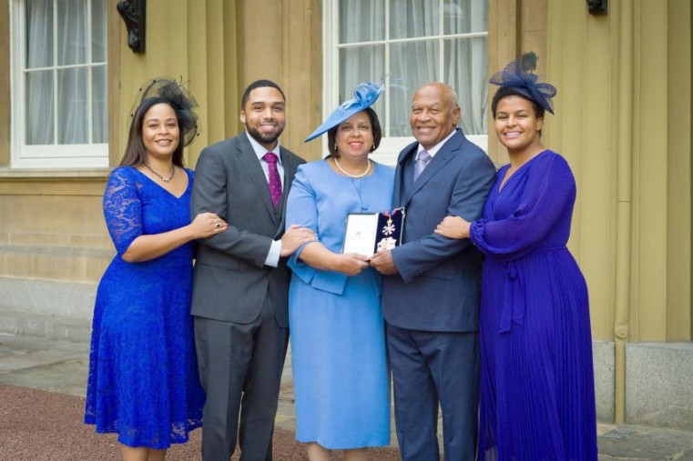 Sir Anthony is joined by his family following the investiture ceremony at Buckingham Palace on 25 October 2023. From left are Leigh, Jonathan, Lady Jacqueline Smellie, Sir Anthony, and Samantha.
