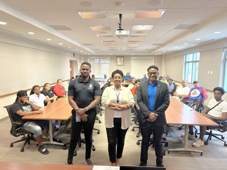 From left to right: PL Inspector - Carl Grant; Land Policy Advisor - Melissa Brown-Watler and PLC Secretary - Jared Smith with vendors in attendance