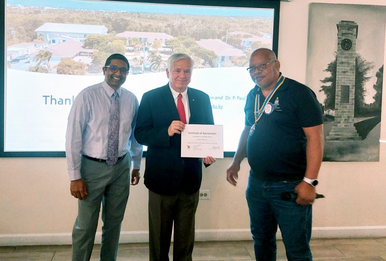 Dr. Peter Paul, Special Assistant to the President,  Dr. Robert W. Robertson, President, and CEO at the University College of the Cayman Islands, along with Mr. Vinton Chinsee of the Rotary Club of Gr