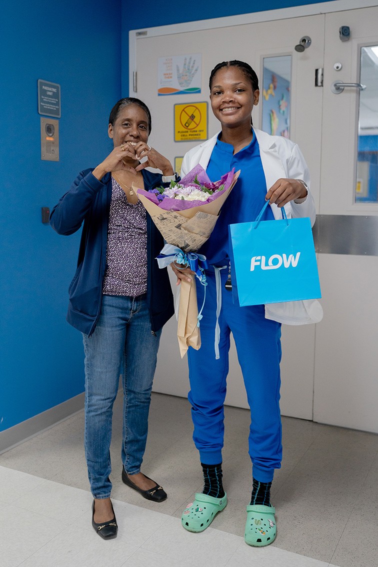 From left: Claudine Ramdon, Senior Network Support Technician at Flow and HSA Recipient Sashaniel McField (right)