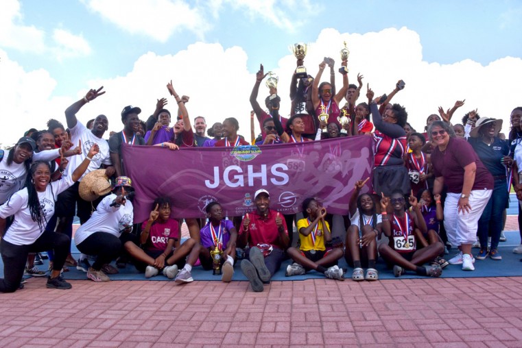 Members of John Gray High School family are jubilant after collecting the winning trophy.