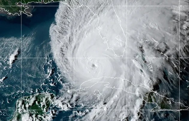 This GOES-East GeoCcolor satellite image taken at 10:10 p.m. EDT on Tuesday, Sept. 27, 2022, and provided by the National Oceanic and Atmospheric Administration (NOAA), shows Hurricane Ian over the Gu