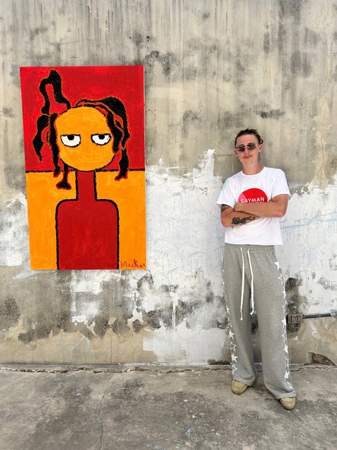 Art Iain MacRae at his ‘Another Young Caymanian’ exhibition at Gram Bellas, North Side_Photo by Natalie Urquhart