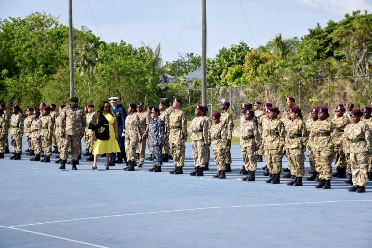 Minister for Home Affairs, Honourable Sabrina Turner inspects new cadet graduates during the Cayman Islands Cadet Corps passing out parade held at the Truman Bodden Sports Complex recently.