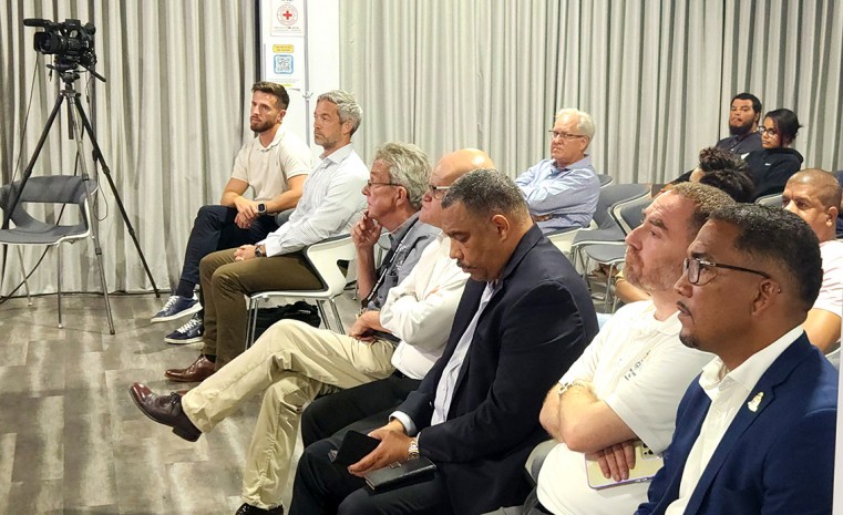 Tourism Minister Kennet Bryan looks on as the case is made for the new cargo port in Grand Cayman.