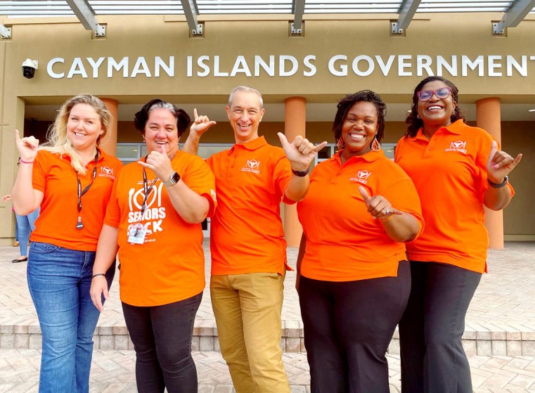 Cost U Less employees wear orange to support MOW