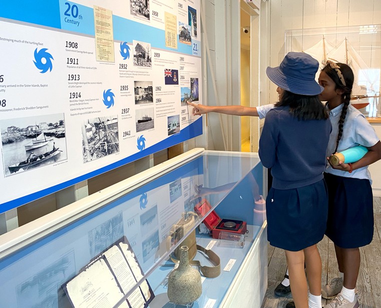 Students exploring the timeline in the Cultural History gallery.