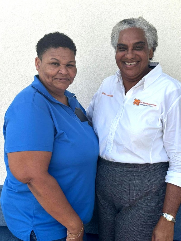 Cayman Brac & Little Cayman Registering Officer, Mrs. Ellen Lazzari (right) and her assistant Cathy Scott (left).