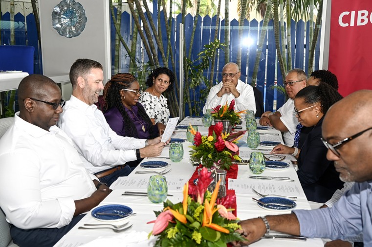 Mark McIntyre (right) was joined by his wife Anita (left) at the retirement luncheon hosted by CEO Mark St. Hill (centre) and senior executives