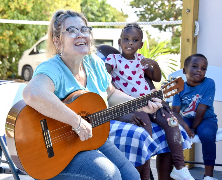 Juliet Pilgrim, Education and Outreach Coordinator for LIFE Cayman, leads a fun sing-along at a Family Circle Session.