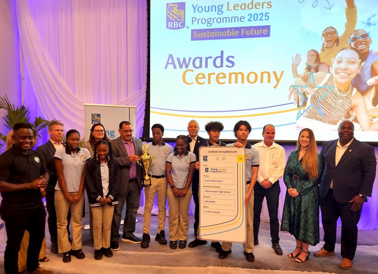 Clifton Hunter students stand with Government Ministers and RBC staff to receive an award of CI$15,000 for their ‘Plastic to Purpose’ project, as part of the RBC Young Leaders Programme.