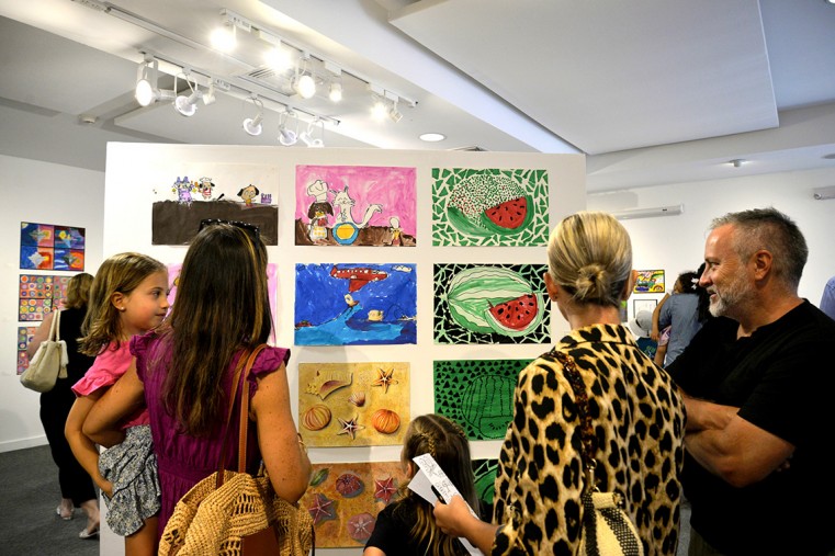 Families enjoy the artwork at the recent exhibition opening